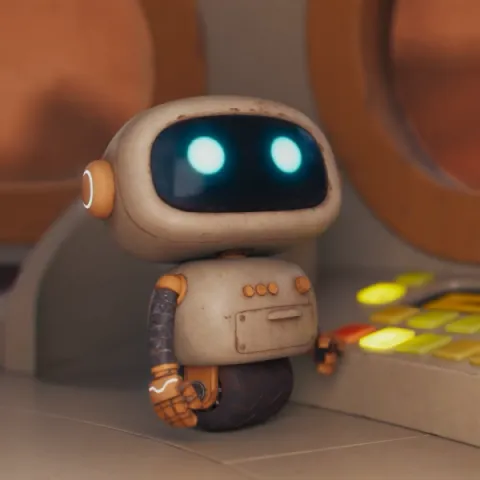 A small beige robot looking up with bulging blue eyes. The robot appears to be controlling a control panel of buttons.